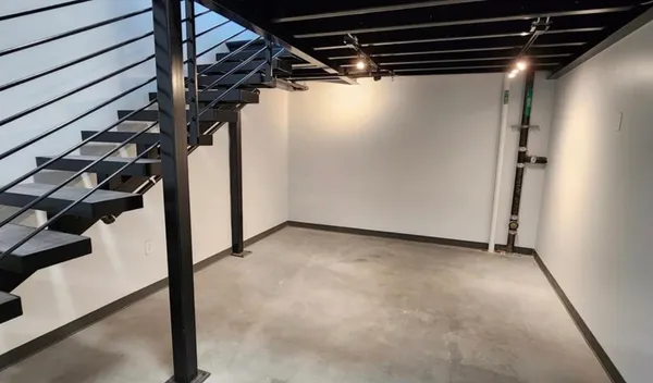 a view of a dining room with furniture and window