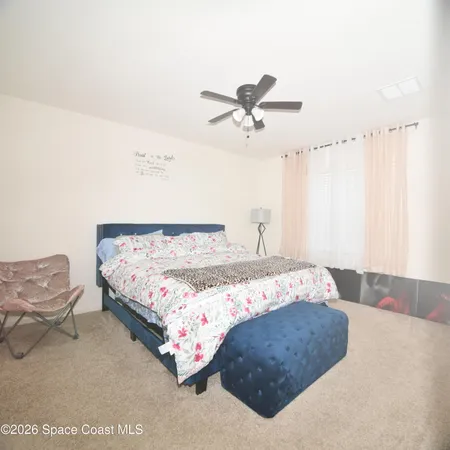 a spacious bathroom with a sink a mirror and a shower