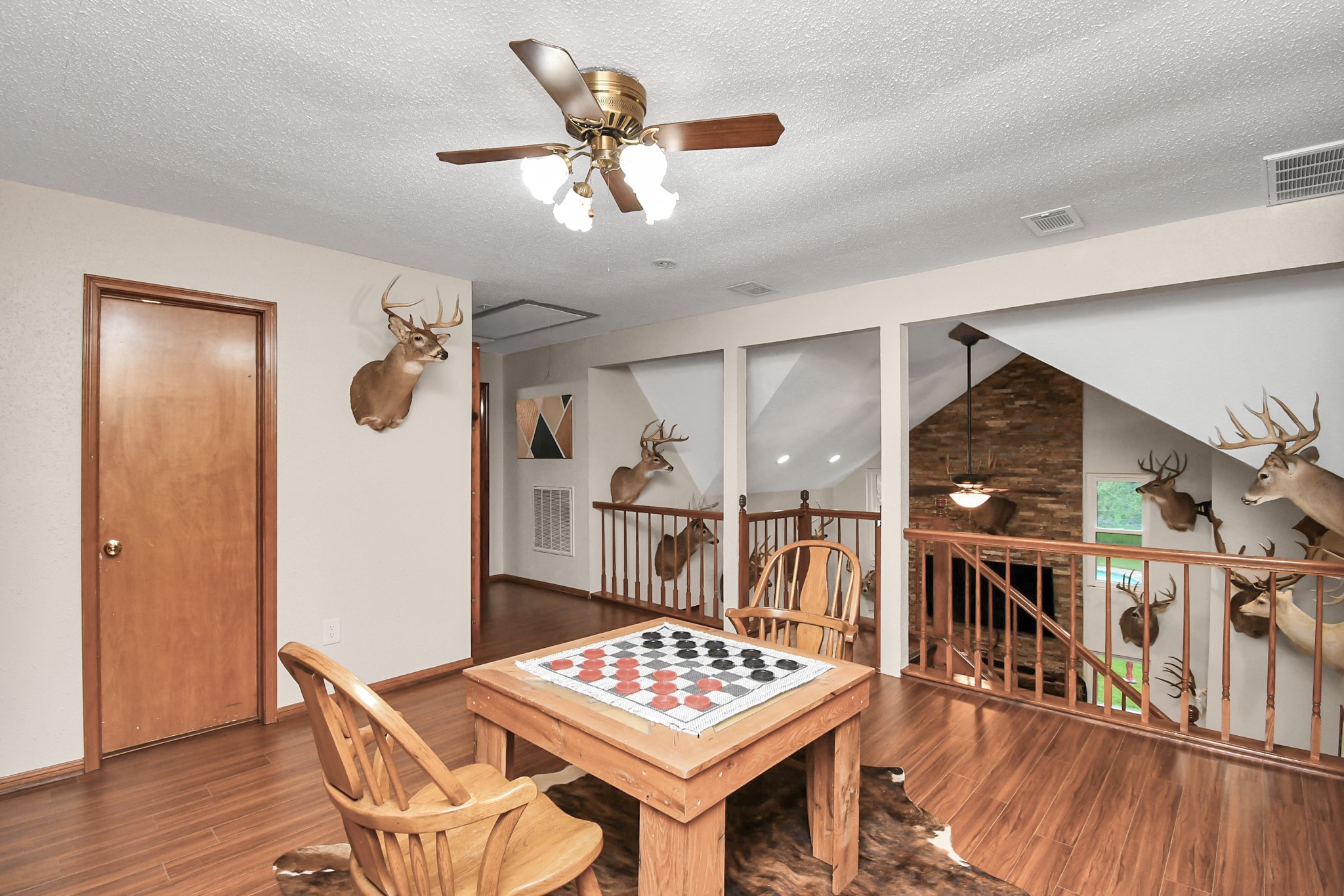 20202 Deer Run Road Damon, TX 77430 - Photo 26 of 45 Game room with full upstairs bath to the right.