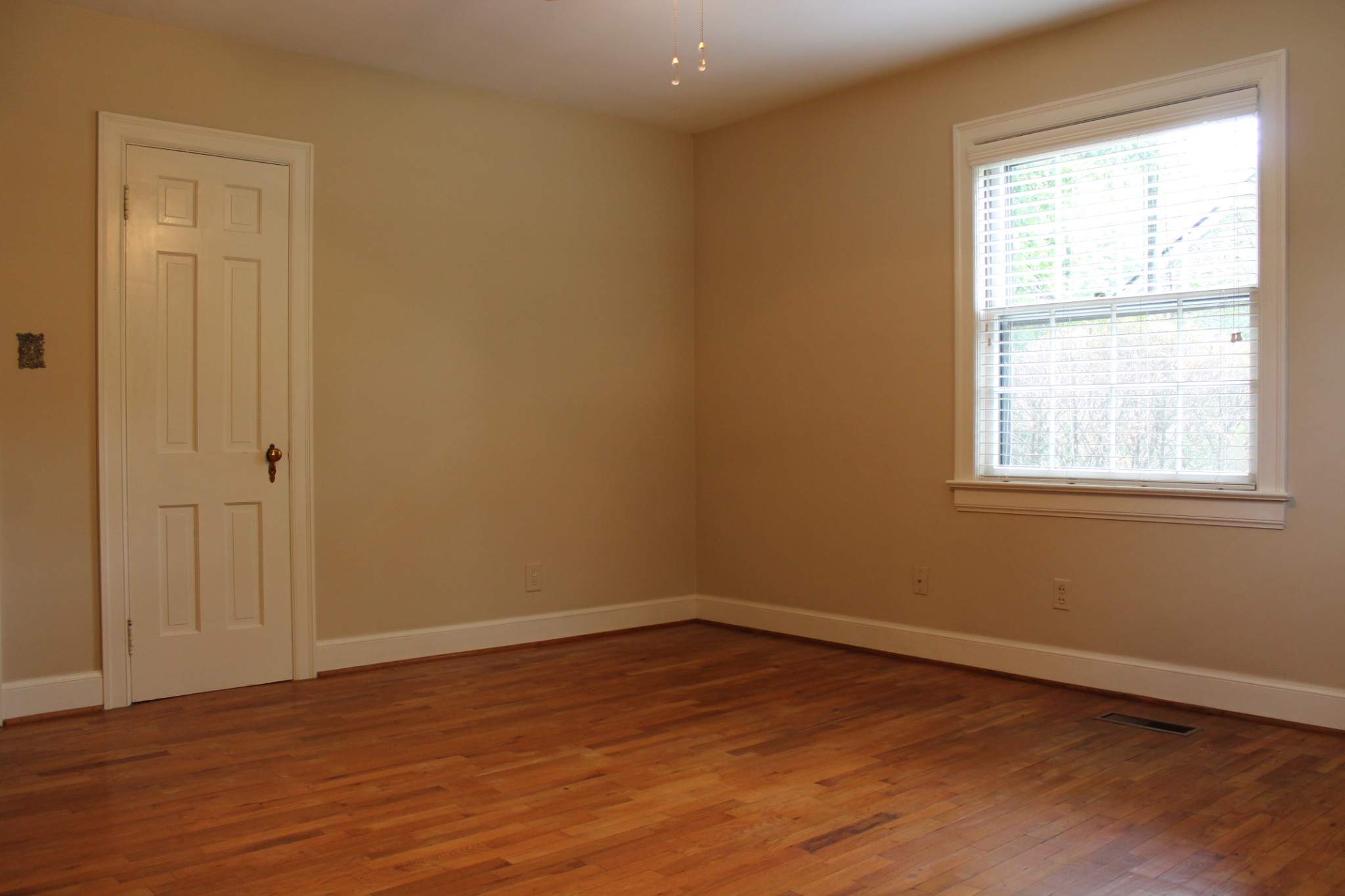 207 Battle Avenue Franklin, TN 37064 - Photo 44 of 67 a view of an empty room with wooden floor and a window