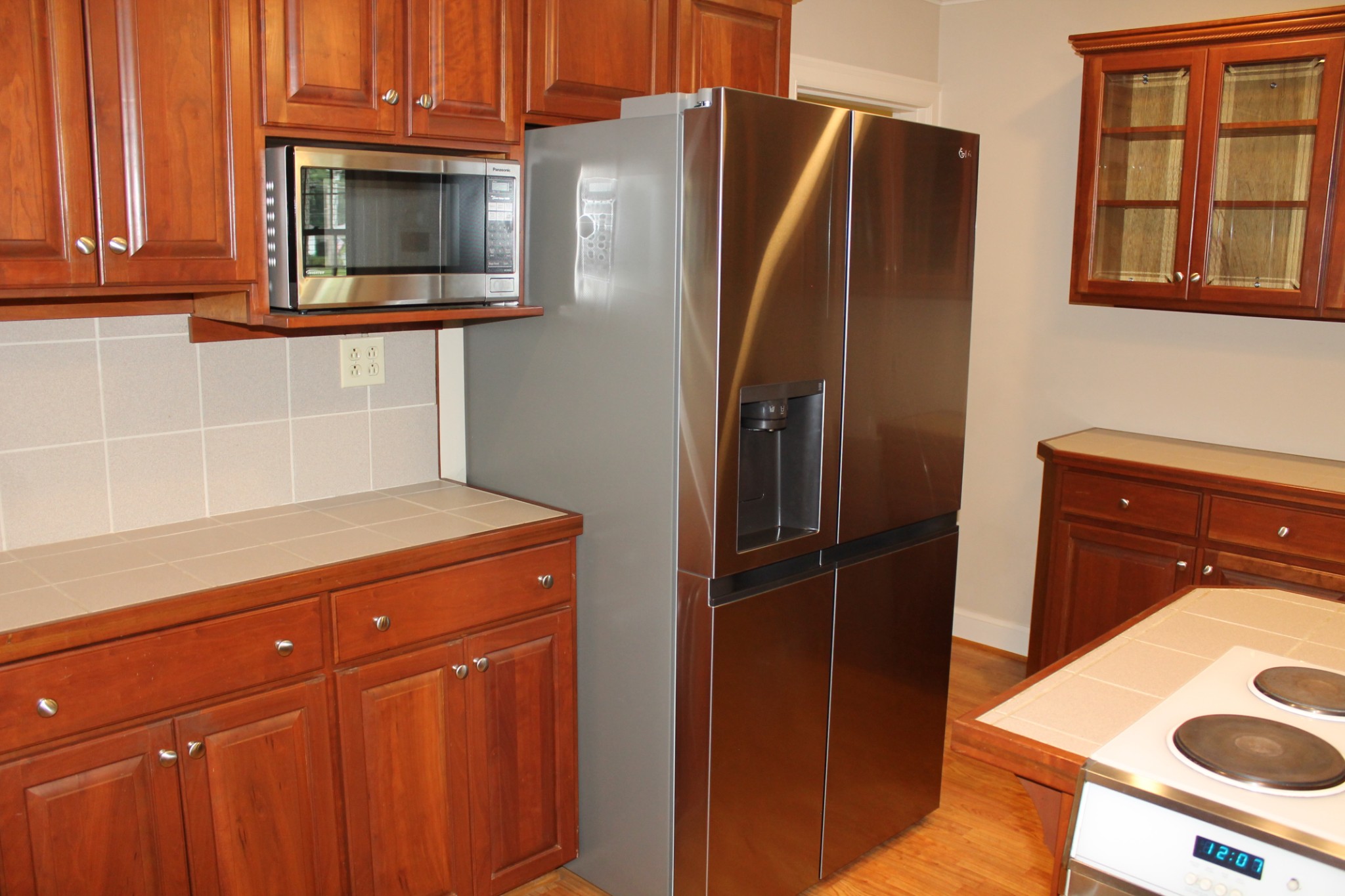 207 Battle Avenue Franklin, TN 37064 - Photo 50 of 67 a kitchen with stainless steel appliances granite countertop a refrigerator and microwave
