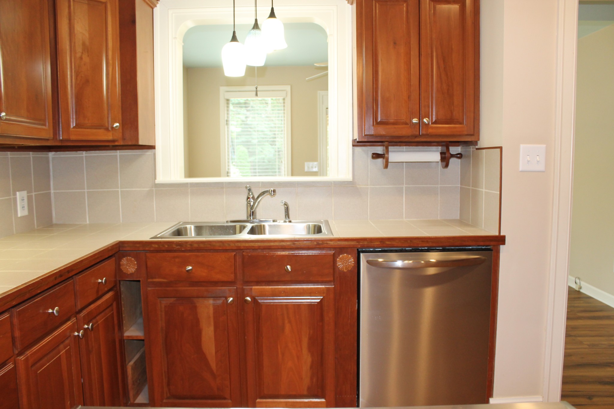 207 Battle Avenue Franklin, TN 37064 - Photo 52 of 67 a kitchen with stainless steel appliances granite countertop a sink dishwasher and cabinets with wooden floor