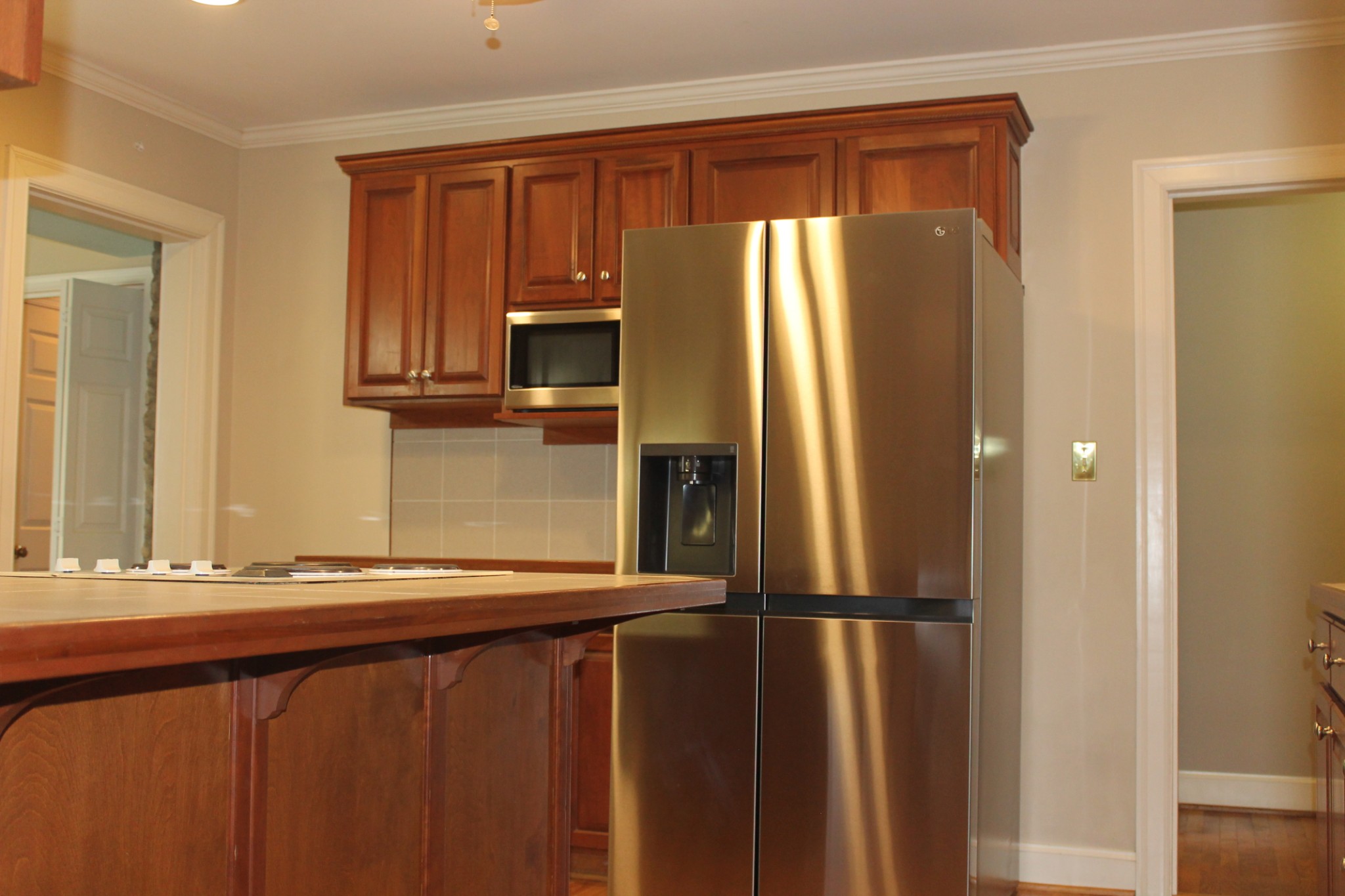 207 Battle Avenue Franklin, TN 37064 - Photo 57 of 67 a kitchen with granite countertop a refrigerator and a sink