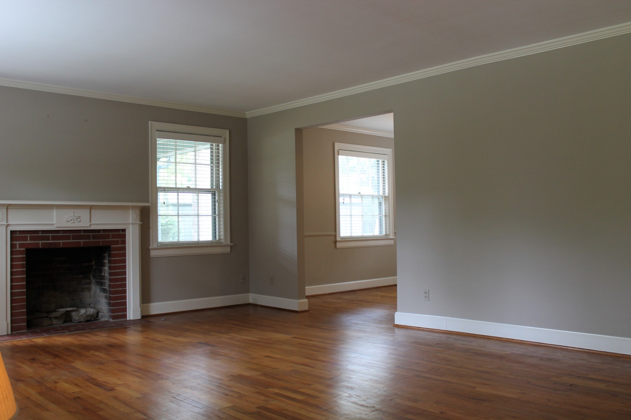 207 Battle Avenue Franklin, TN 37064 - Photo 62 of 67 an empty room with wooden floor fireplace and windows