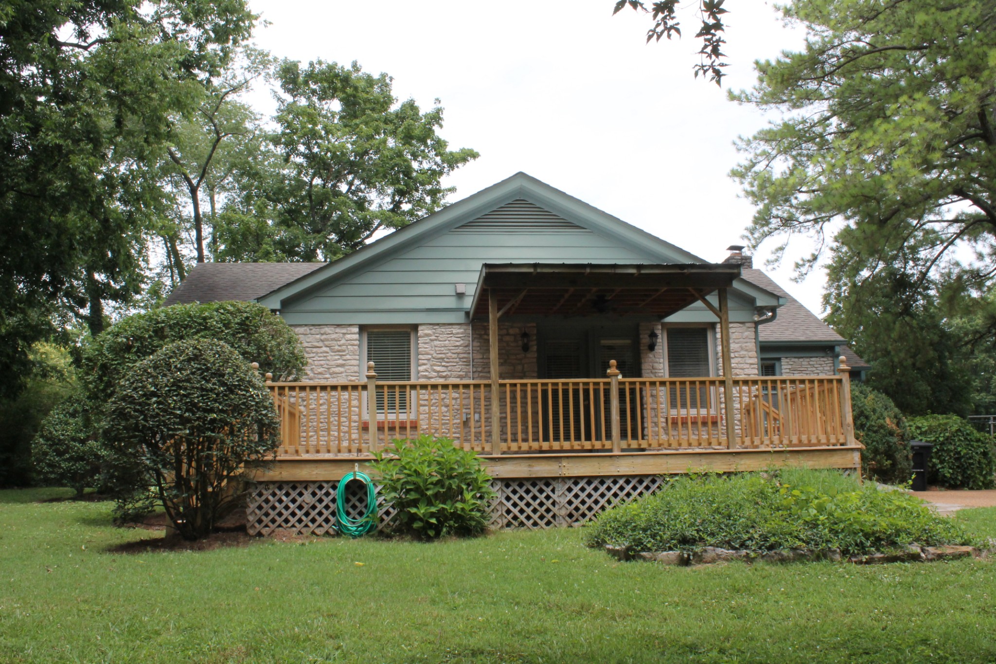 207 Battle Avenue Franklin, TN 37064 - Photo 8 of 67 a front view of a house with a garden