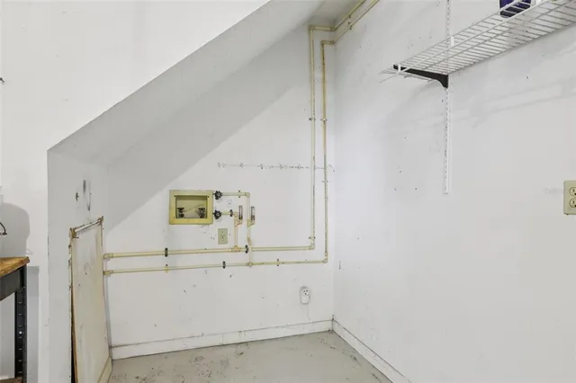 a wooden bench sitting in front of a house