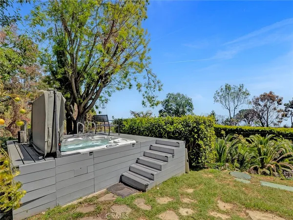 a view of a pathway with a wrought fence