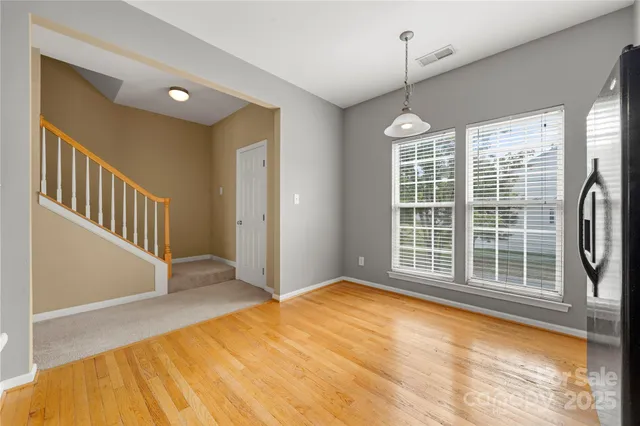 a view of empty room with windows