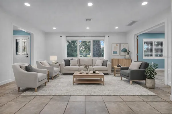 a living room with furniture and a large window