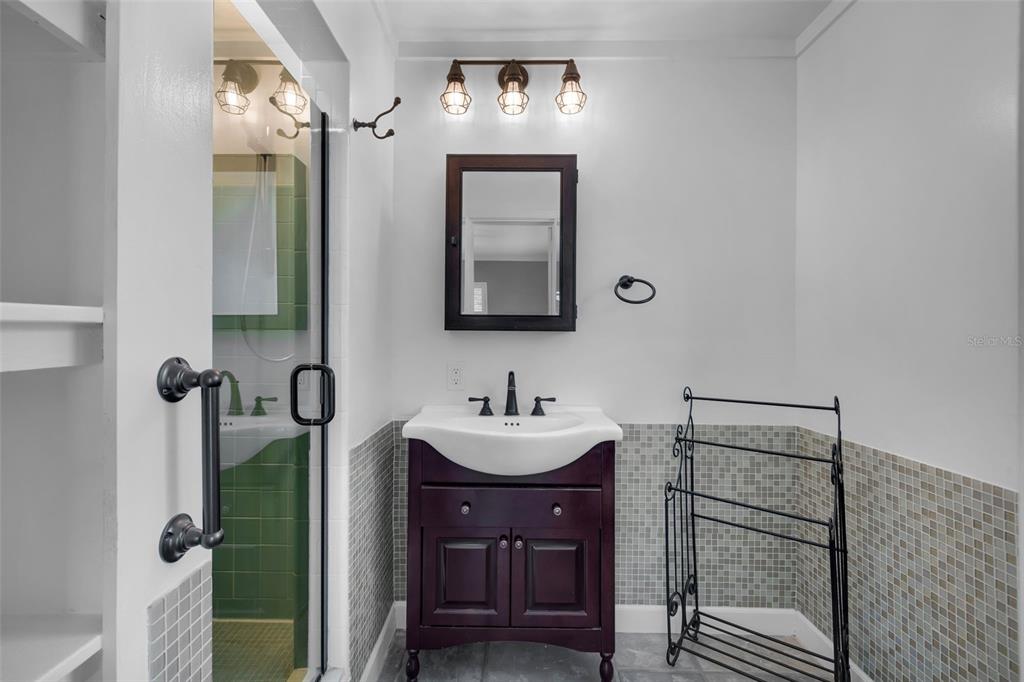 307 West 4th Avenue Windermere, FL 34786 - Photo 22 of 56 a bathroom with a sink a mirror and vanity