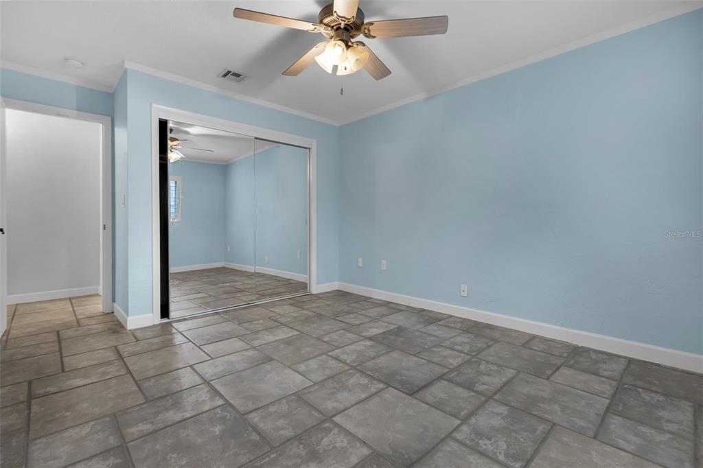 307 West 4th Avenue Windermere, FL 34786 - Photo 26 of 56 an empty room with closet and a chandelier fan