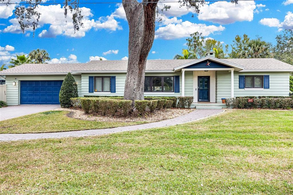 307 West 4th Avenue Windermere, FL 34786 - Photo 3 of 56 a front view of a house with a yard