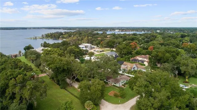 a view of a lake with houses in the back