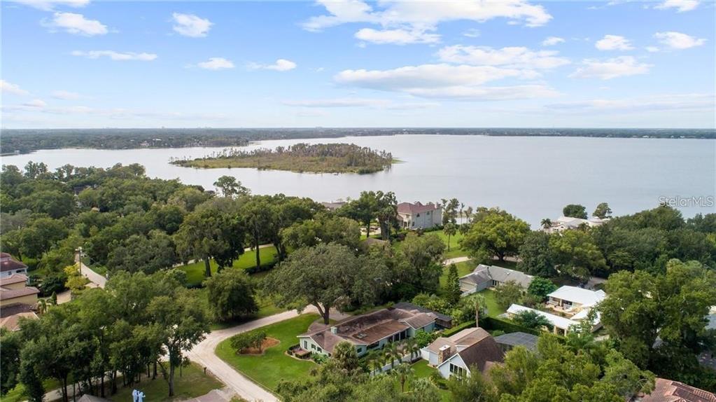 307 West 4th Avenue Windermere, FL 34786 - Photo 55 of 56 a view of a lake with houses in the back