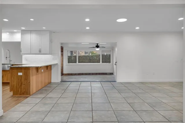 a view of a kitchen with a sink and a window