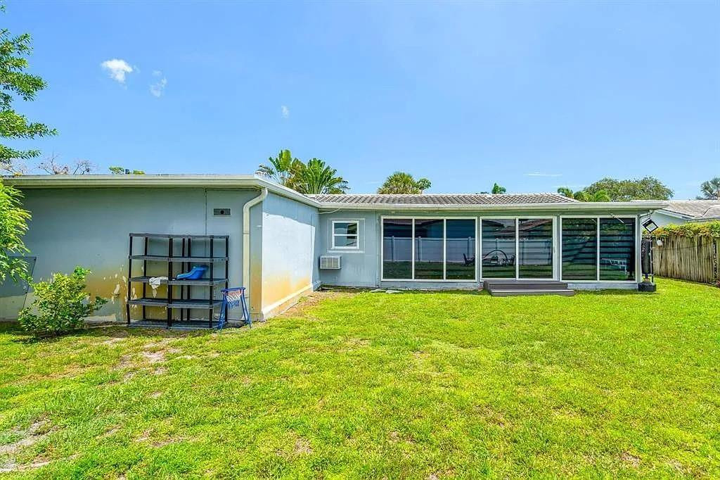 4100 North 36th Avenue Hollywood, FL 33021 - Photo 12 of 12 a view of a house with pool and garden
