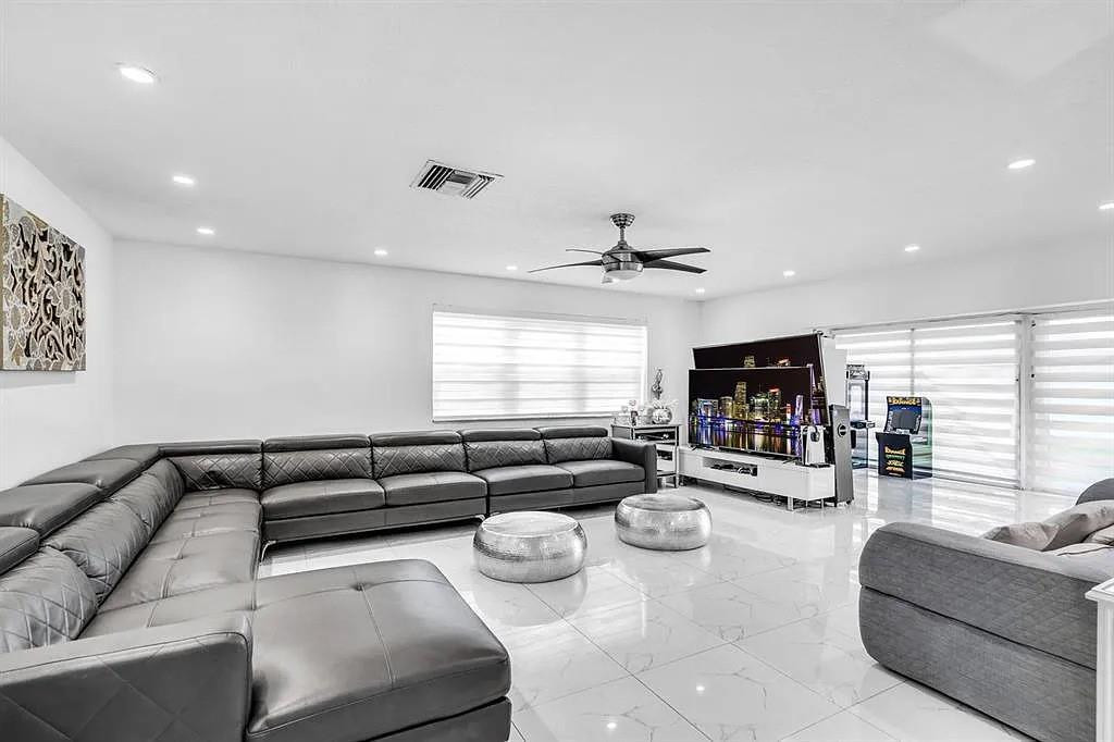 4100 North 36th Avenue Hollywood, FL 33021 - Photo 5 of 12 a living room with furniture fireplace and a large window