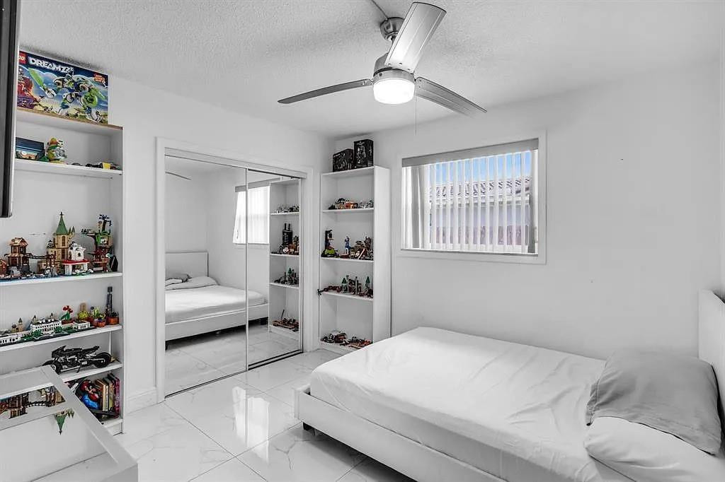 4100 North 36th Avenue Hollywood, FL 33021 - Photo 9 of 12 a bedroom with a bed and a window