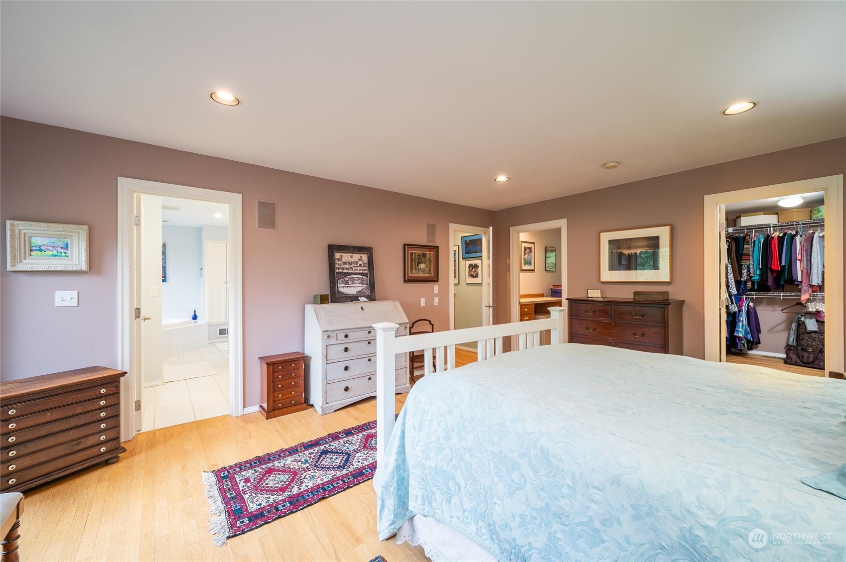 1835 High Noon Road Bellingham, WA 98226 - Photo 16 of 40 a bedroom with a large bed and a book shelf
