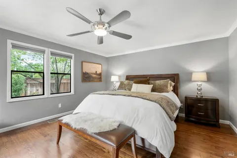 a bedroom with a large bed and a tv