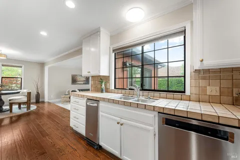 a kitchen with a sink stove and cabinets