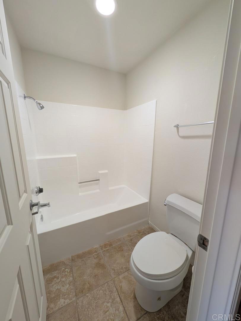 200 East Alessandro Boulevard, Unit 34 Riverside, CA 92508 - Photo 12 of 22 a bathroom with a toilet and a shower