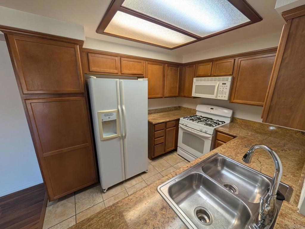 200 East Alessandro Boulevard, Unit 34 Riverside, CA 92508 - Photo 6 of 22 a kitchen with a refrigerator sink and stove