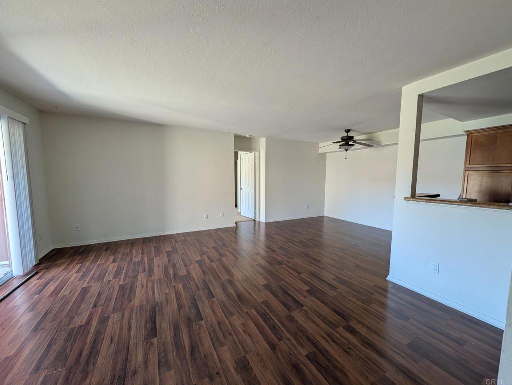 200 East Alessandro Boulevard, Unit 34 Riverside, CA 92508 - Photo 8 of 22 an empty room with wooden floor and closet