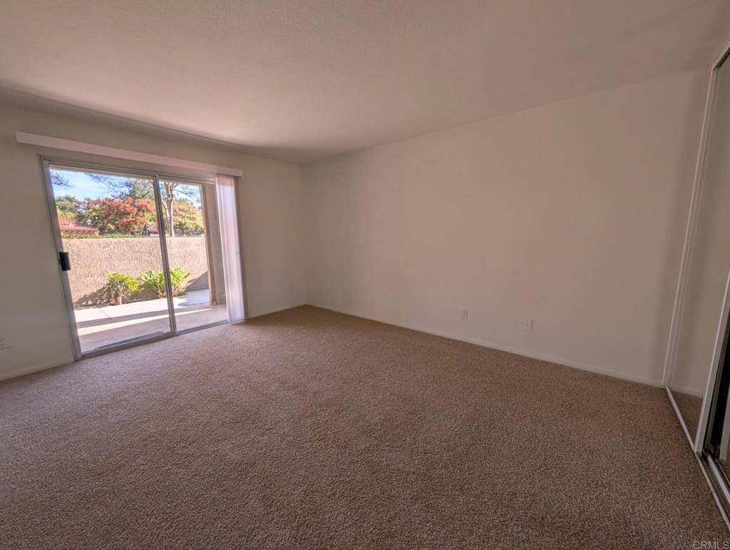 200 East Alessandro Boulevard, Unit 34 Riverside, CA 92508 - Photo 9 of 22 a view of an empty room with a window
