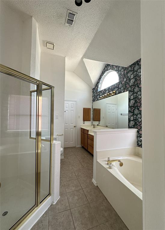 2017 Birch Bend Mesquite, TX 75181 - Photo 24 of 30 a bathroom with a tub a mirror and a shower