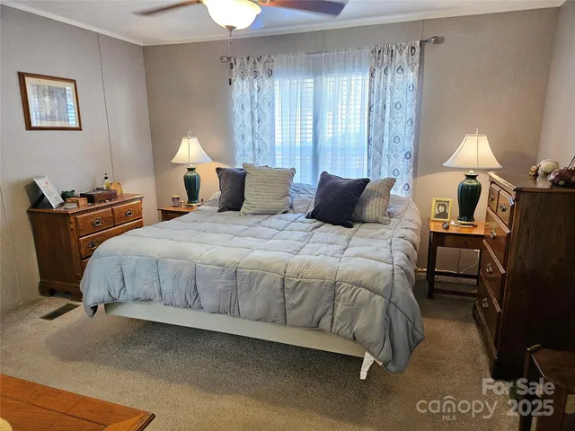 a bed room with a bed and a lamp