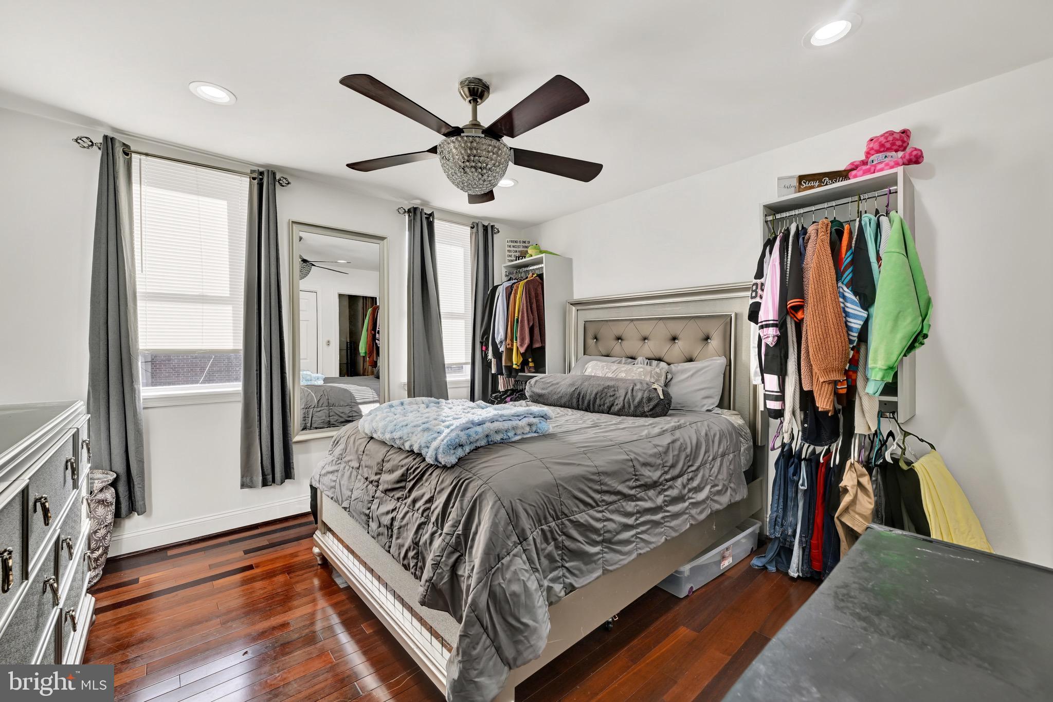 1401 East Lanvale Street Baltimore, MD 21213 - Photo 11 of 17 a bed room with a bed and a chandelier