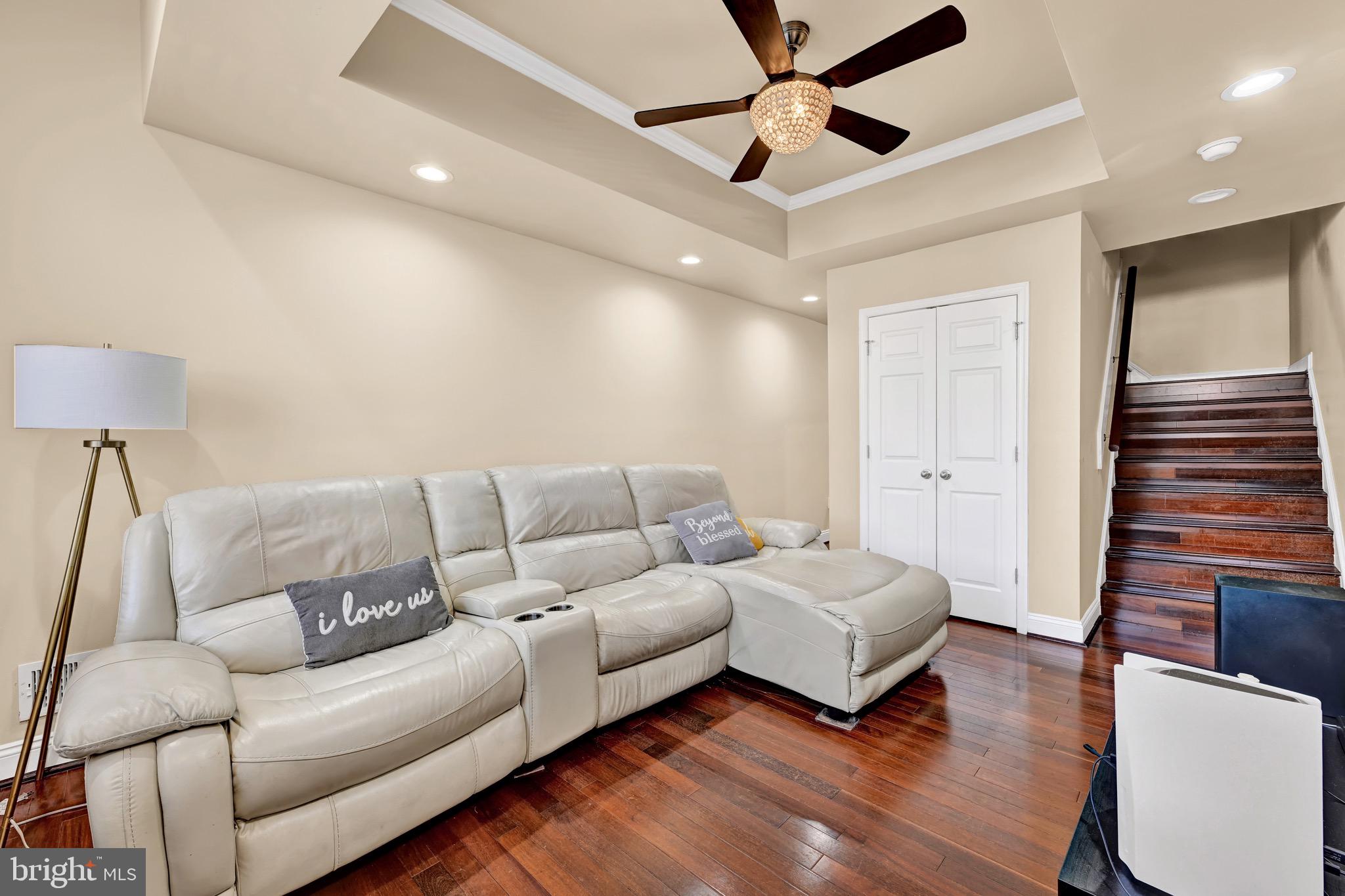1401 East Lanvale Street Baltimore, MD 21213 - Photo 5 of 17 a living room with furniture and a wooden floor