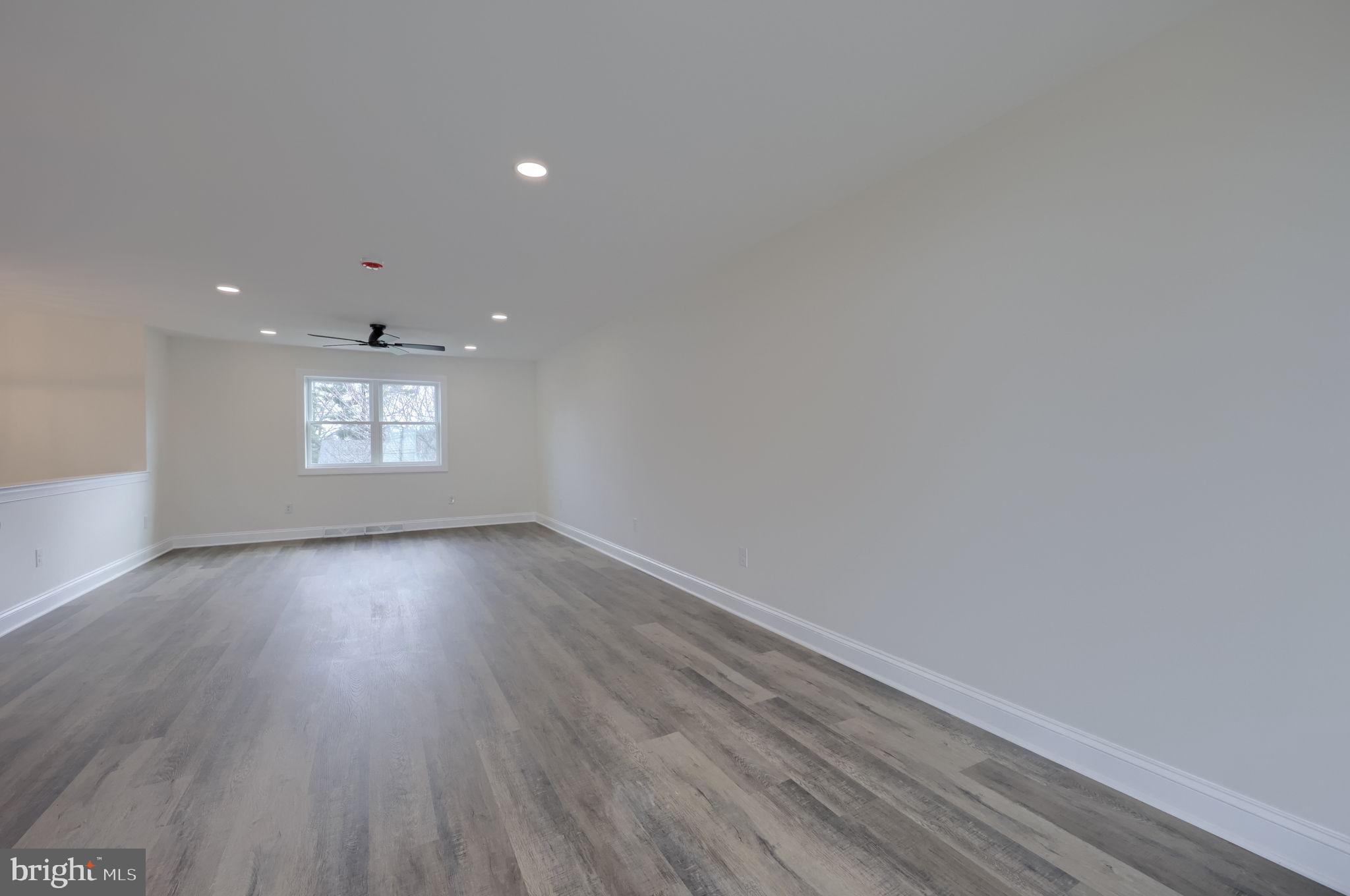 310 Kendale Road Red Lion, PA 17356 - Photo 15 of 42 a view of empty room with window and wooden floor