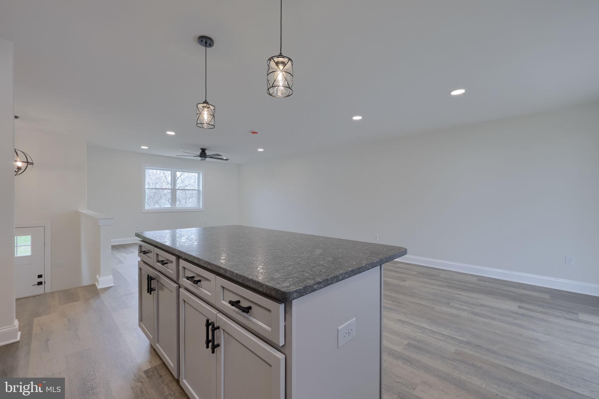 310 Kendale Road Red Lion, PA 17356 - Photo 17 of 42 a kitchen that has a sink a stove and a wooden floor
