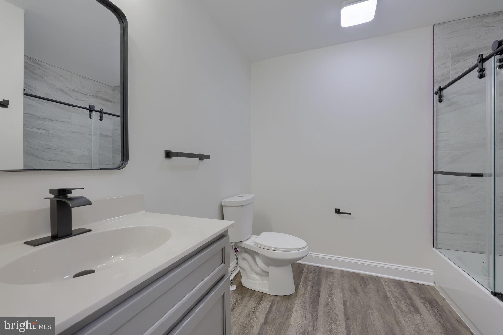 310 Kendale Road Red Lion, PA 17356 - Photo 21 of 42 a bathroom with a sink a toilet and shower