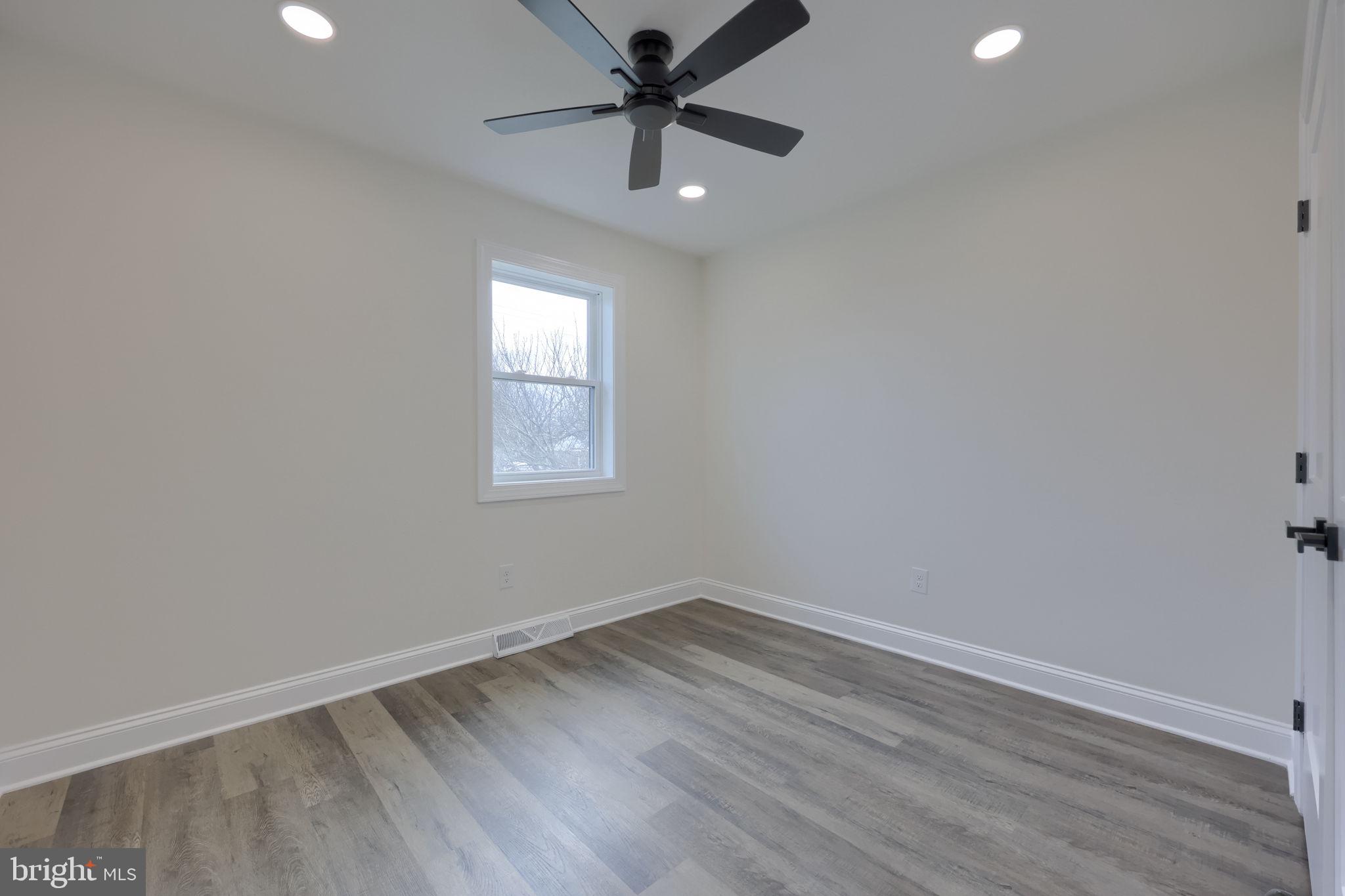 310 Kendale Road Red Lion, PA 17356 - Photo 27 of 42 an empty room with a window and a fan