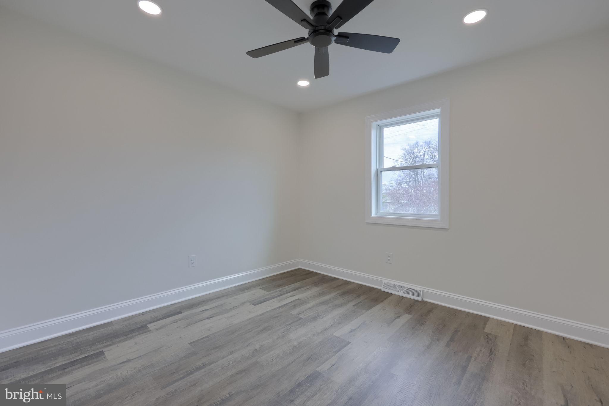 310 Kendale Road Red Lion, PA 17356 - Photo 28 of 42 an empty room with a window and a fan