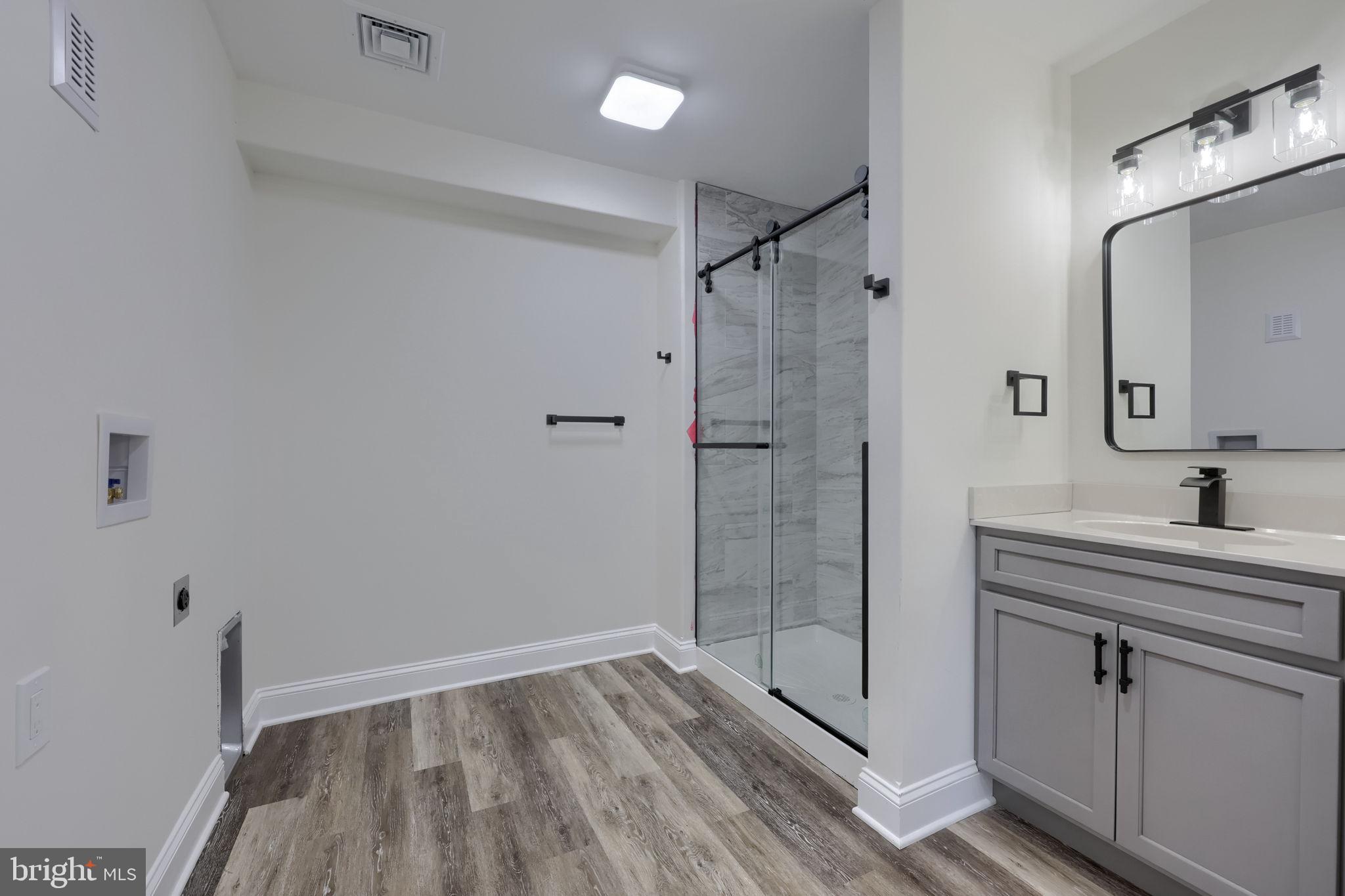 310 Kendale Road Red Lion, PA 17356 - Photo 29 of 42 a bathroom with a shower sink and mirror