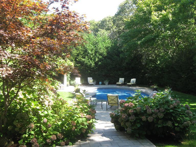 268 Parker Road Osterville, MA 02655 - Photo 3 of 28 a view of a garden with large trees