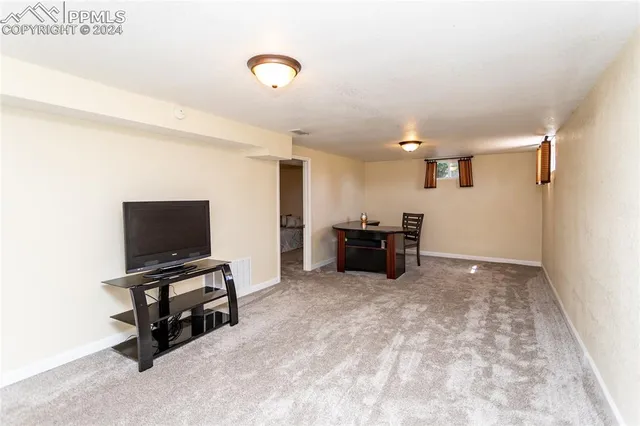 a view of kitchen with microwave and furniture