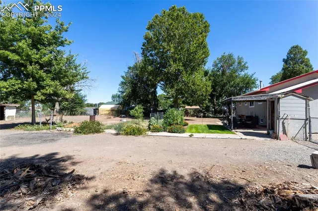 a view of a road with a building in the background