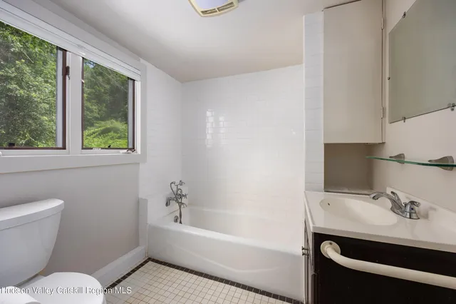 a bathroom with a sink a toilet and a bathtub