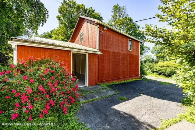 a backyard of a house with wooden fence