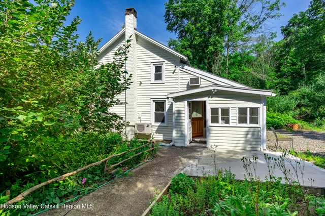 a view of a house with a yard and plants