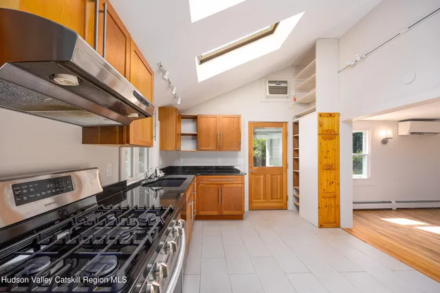 a kitchen with a stove and a refrigerator