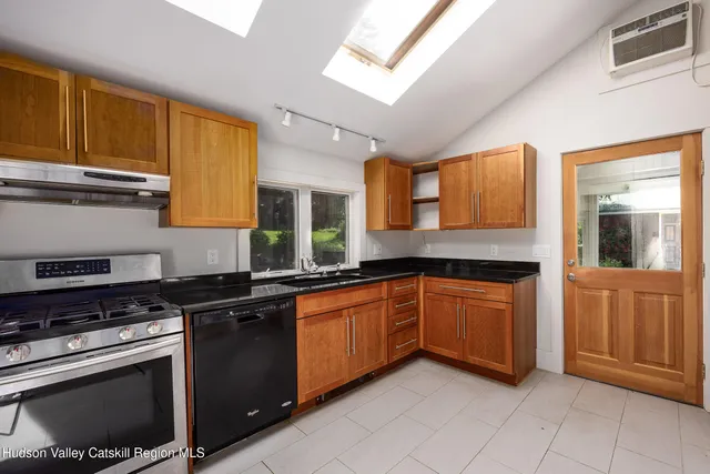 a kitchen that has a sink and a stove