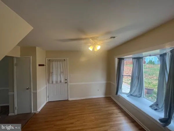 a kitchen with stainless steel appliances granite countertop a refrigerator and a stove