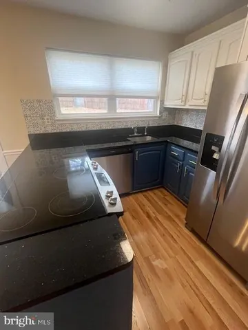 an empty room with windows and entrance