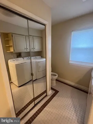 a view of house with hallway and wooden floor